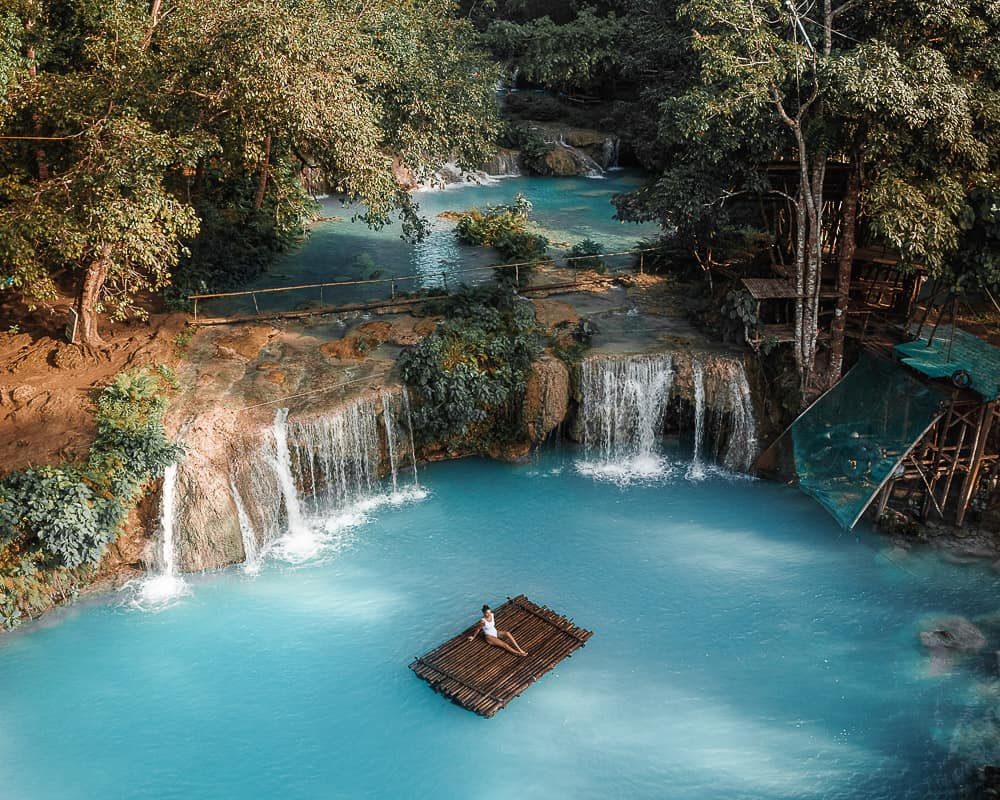 Multi-tiered waterfall in Siquijor with turquoise pools